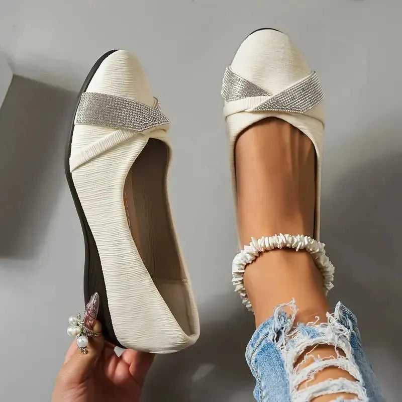 Black women's slip-on casual shoes with rhinestone detail and a chunky heel.