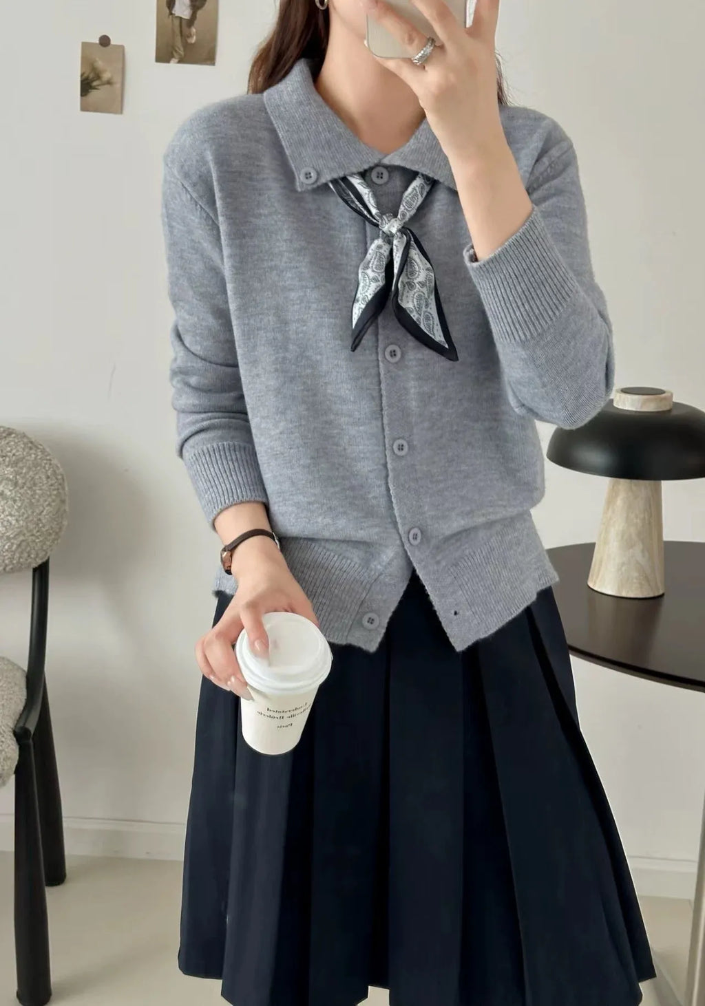Women's grey lapel scarf cardigan sweater with colour-block panels and long sleeves.