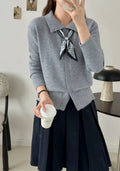 Women's grey lapel scarf cardigan sweater with colour-block panels and long sleeves.
