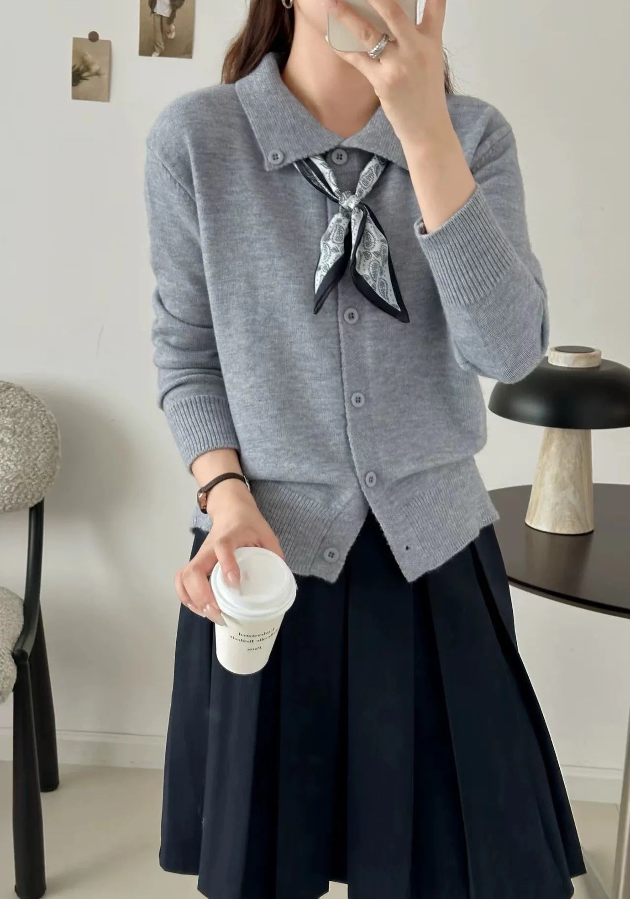 Women's grey lapel scarf cardigan sweater with colour-block panels and long sleeves.