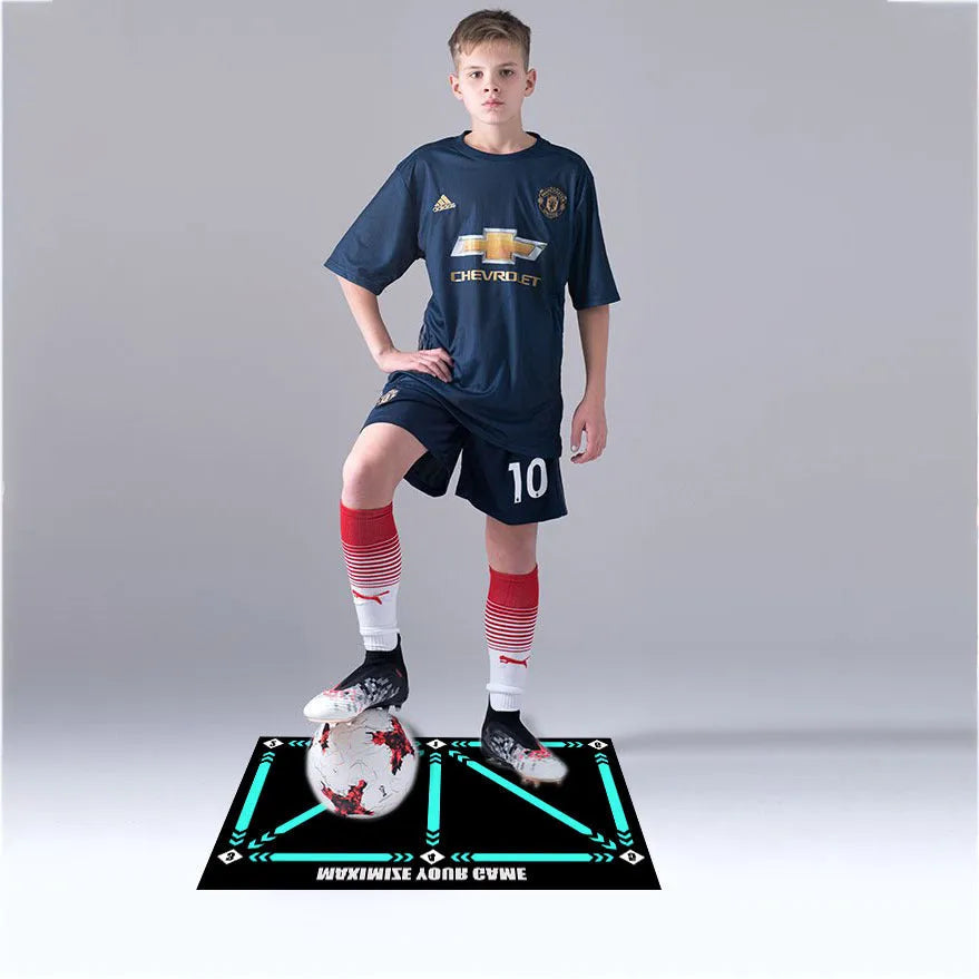 Black rectangular football training mat measuring 60cm by 90cm with non-slip surface