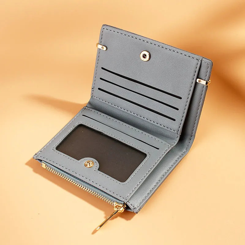 Compact ladies wallet showing multiple internal compartments with zipper closure in various colour options