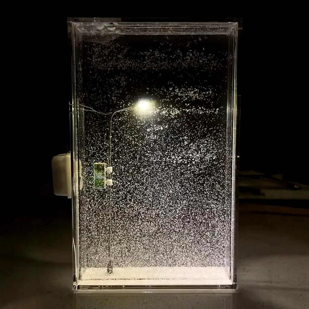 DIY snowy night light kit showing miniature landscape with LED illumination for desktop decoration