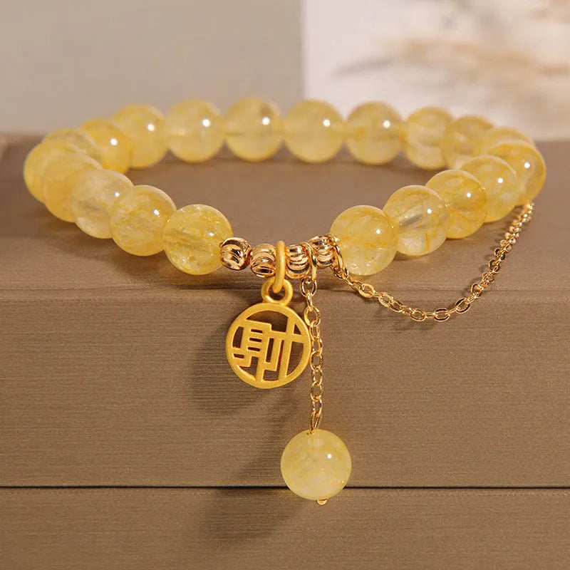 Natural citrine bracelet with Chinese character tassel in gold electroplated finish