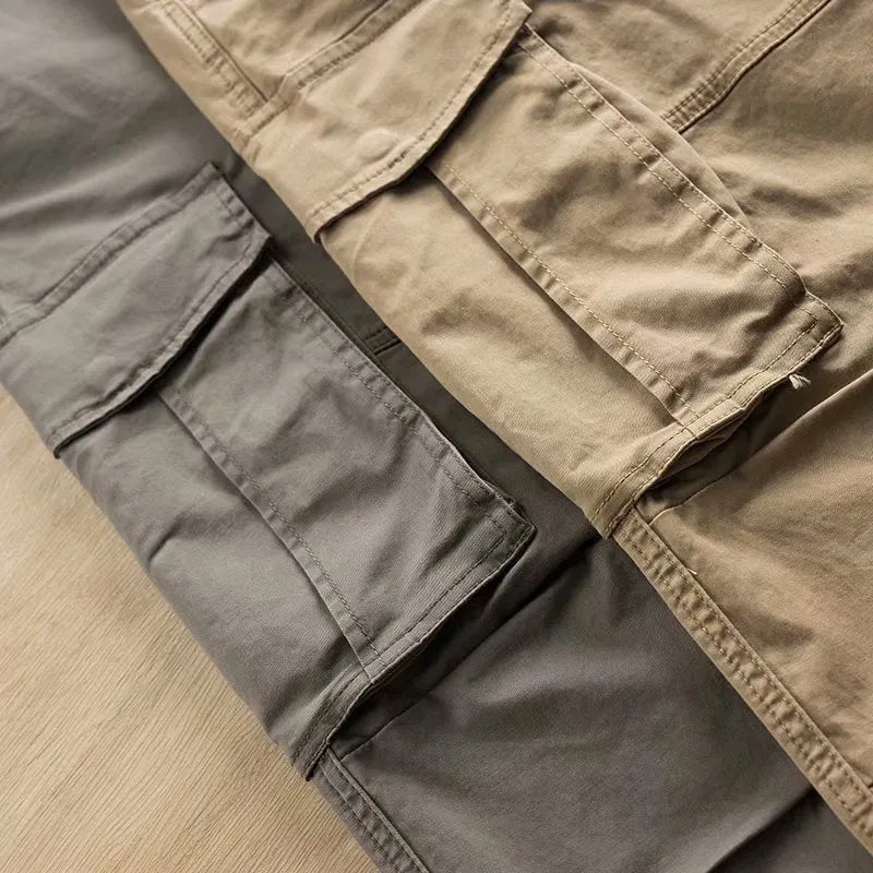 Men's multi-pocket cotton labour protection trousers in khaki, showing cropped leg length and solid colour design.
