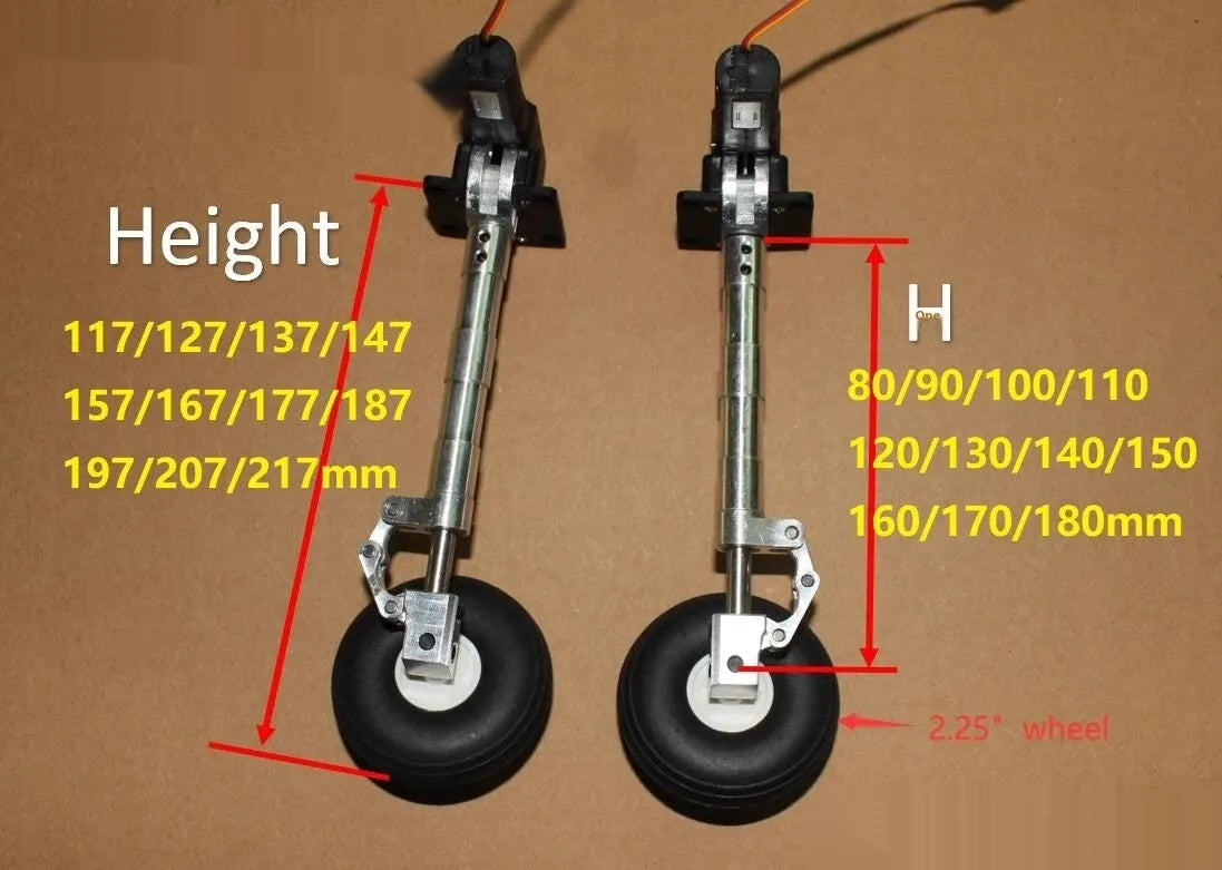 Pair of silver alloy retractable landing gear with shock absorbers and black rubber wheels for RC model aircraft.