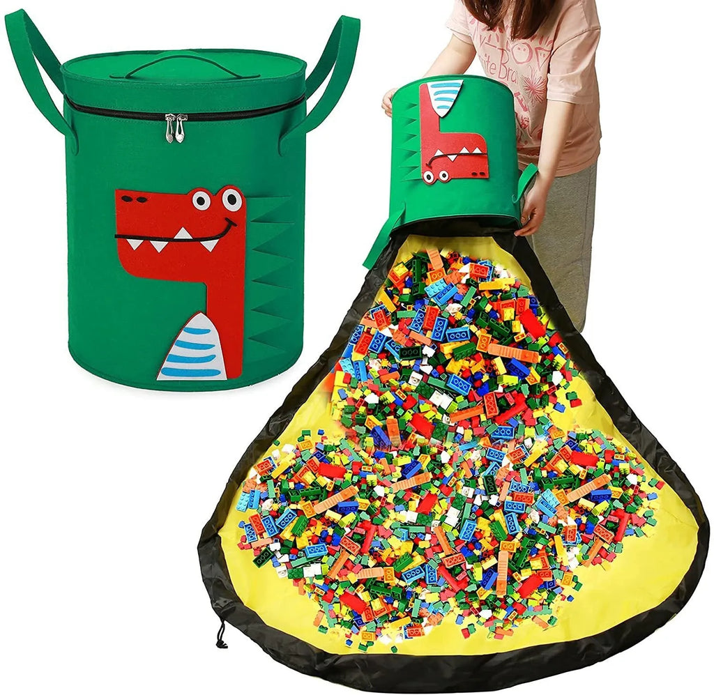 Green cube-shaped felt storage bag with pull rope, laid flat as a play mat.