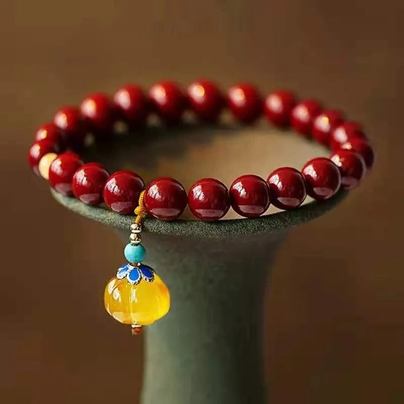 Gold cinnabar wave bracelet with copper beads in national style design