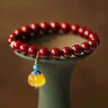 Gold cinnabar wave bracelet with copper beads in national style design