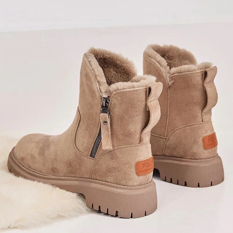 Women's black high-top snow boots with faux suede uppers, side zipper, and fluffy fur lining.