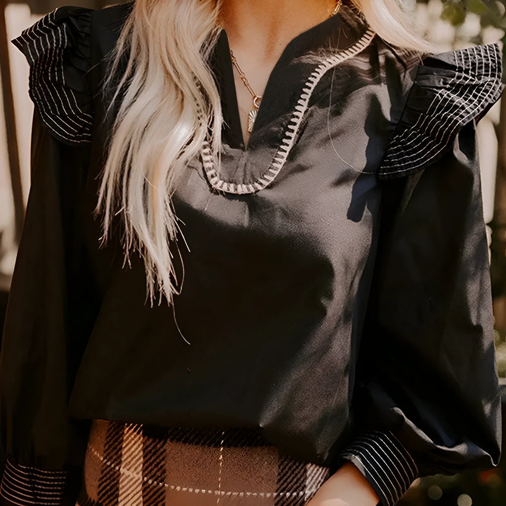 Black women's blouse with V-neckline and long ruffle sleeves
