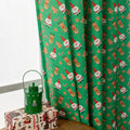 Green Christmas curtain with printed cartoon snowman and angel figures