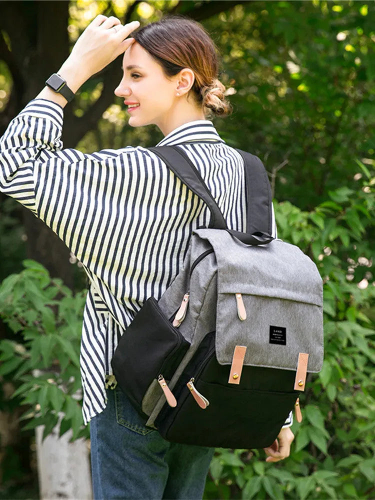 LAND Mommy large oxford cloth diaper backpack with changing mat in beige colour.