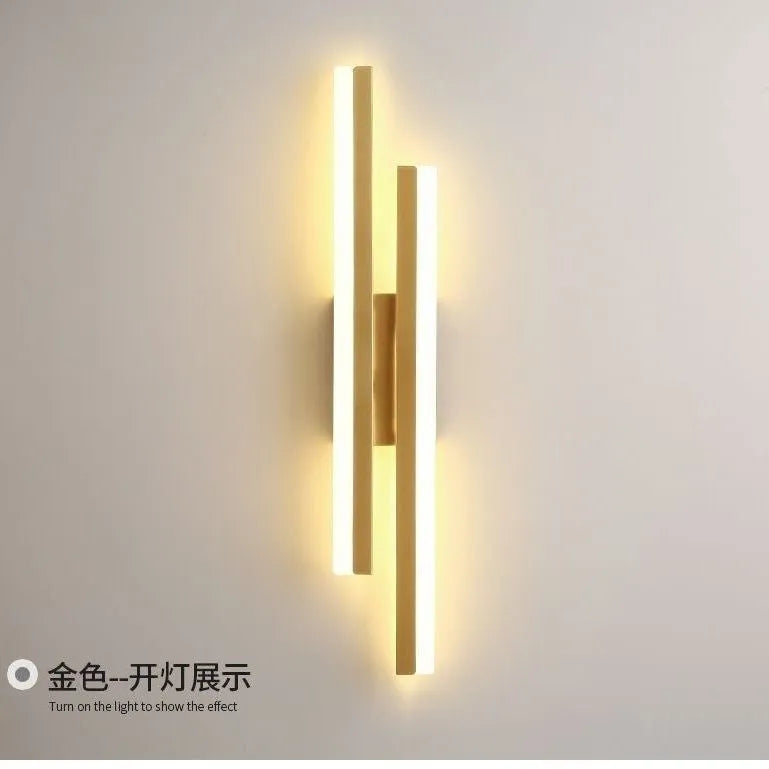 Scandinavian minimalist LED wall light with an acrylic shade on a black arm, mounted on a light-coloured wall.