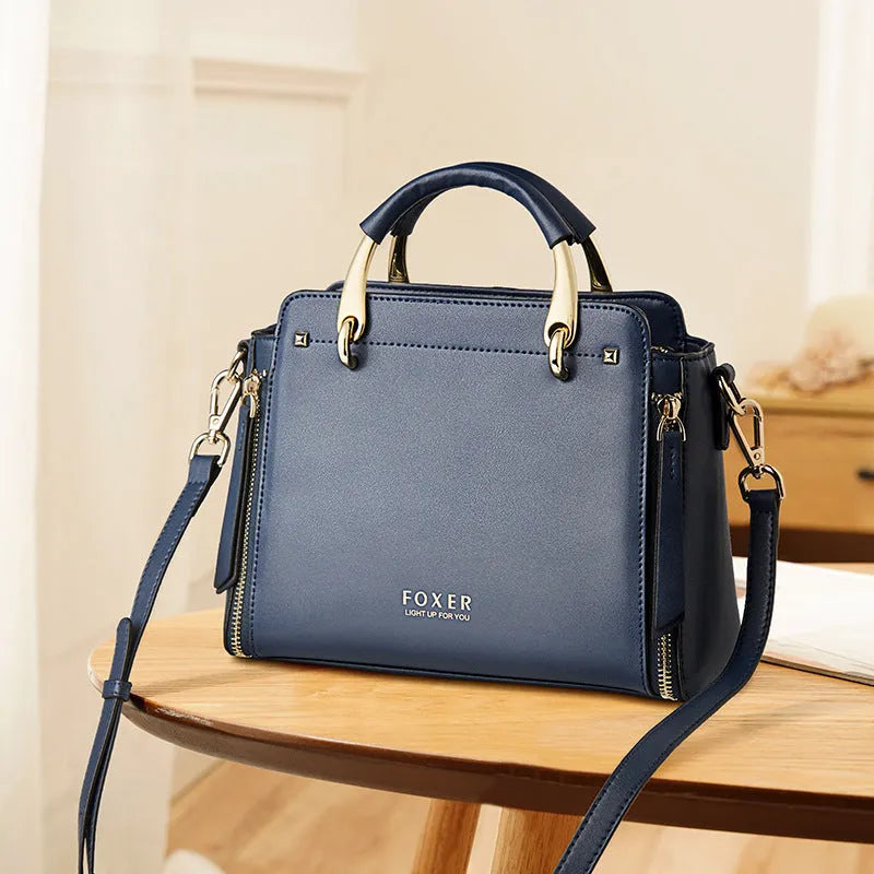 Small trapezoid shoulder bag with colour contrast, zip opening and soft handle in red, black, blue or white