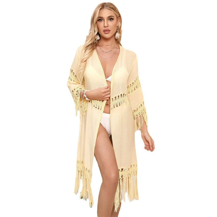 Hand crocheted loose fit beach cardigan in water green with tassel trim.