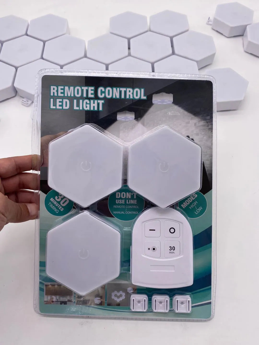 White wireless remote control pat light with touch button and compact rectangular design