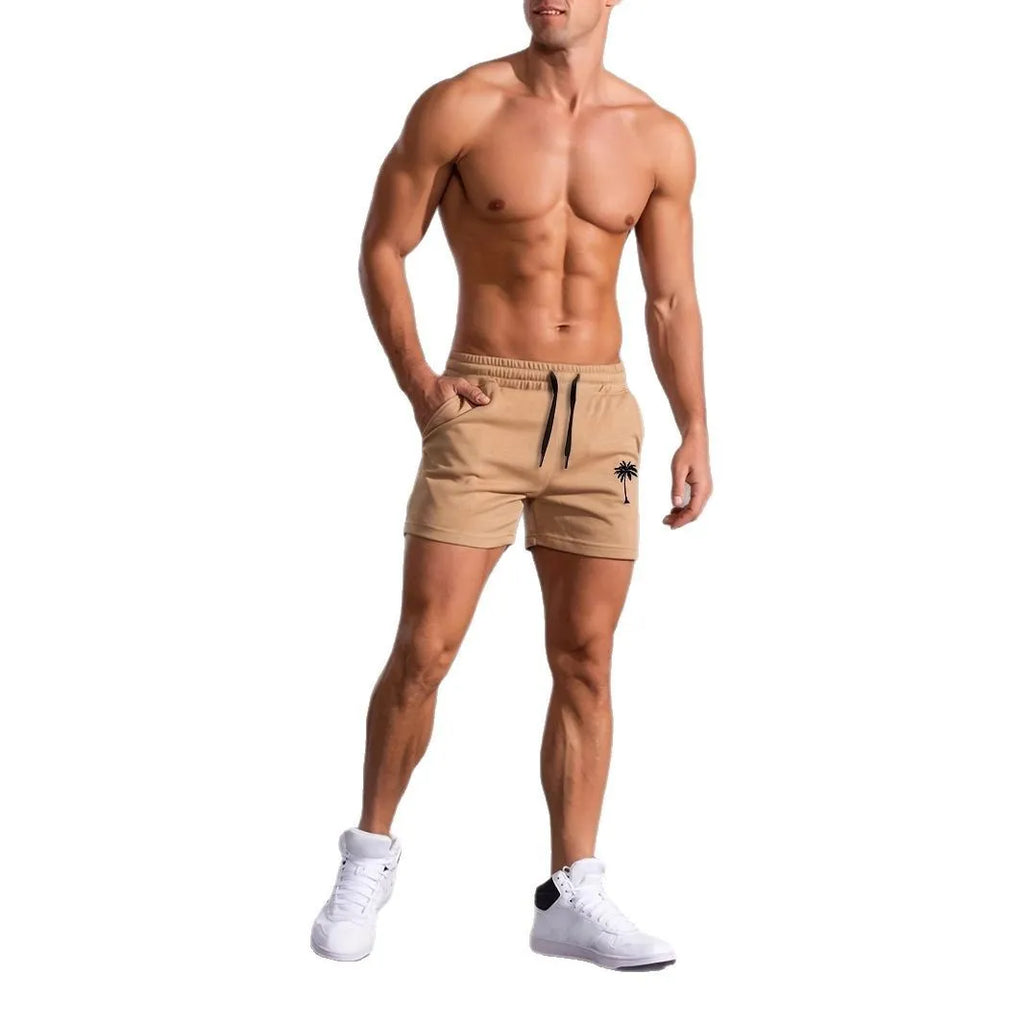 Men's khaki sports shorts with coconut leaf print pattern and straight leg design