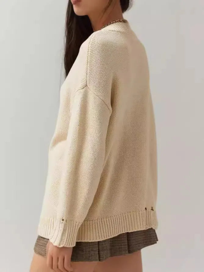 Women's Milky White acrylic Jacquard pullover sweater with a round neck and loose long sleeves.