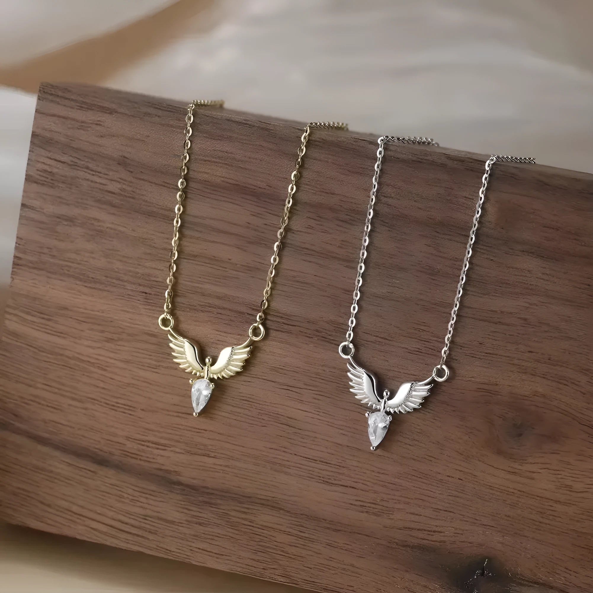 Sterling silver eagle pendant necklace with an O-ring chain on a model, showing white gold colour finish.