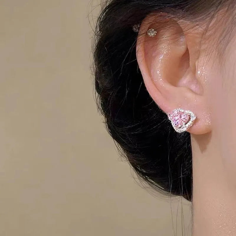 Heart shaped stud earrings with white k finish and copper construction for women