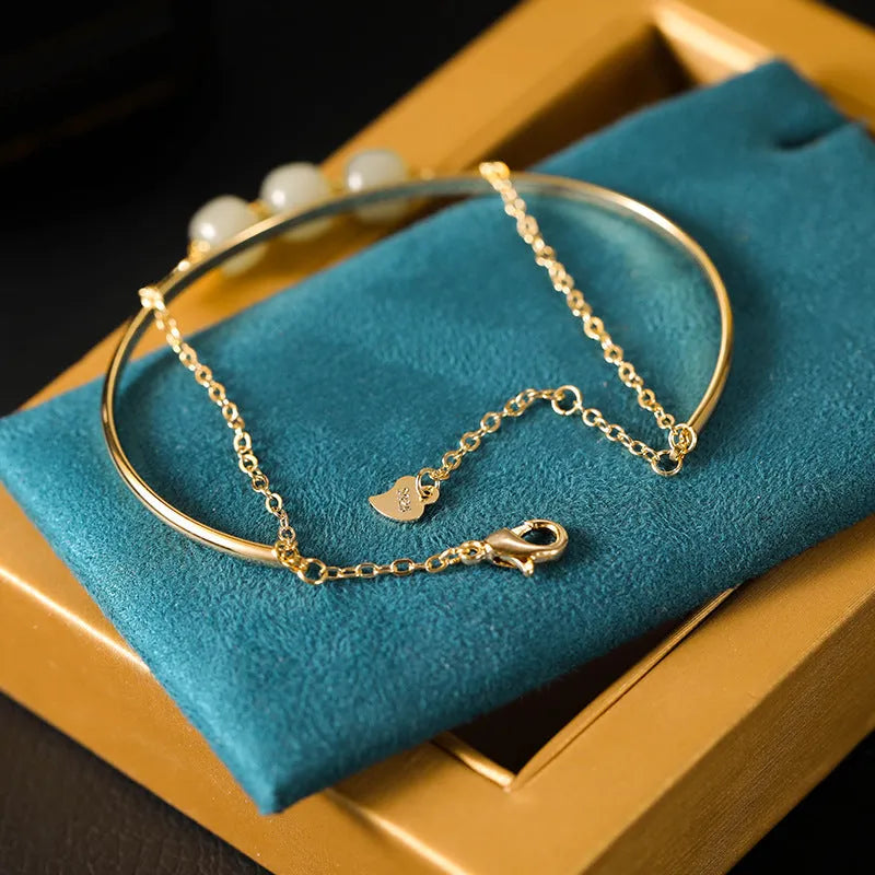 Hetian jade women's bracelet with gold inlay and lucky beads, shown in single, double, and three-bead versions.