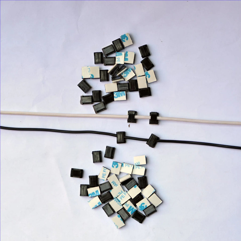 Black PA66 plastic automotive cable retaining clips for wiring management measuring 9mm by 12mm by 6.2mm