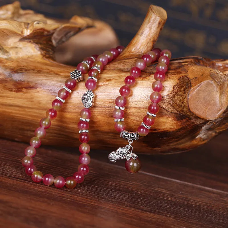 Handmade watermelon crystal bracelet with traditional Chinese knot design in geometric beads