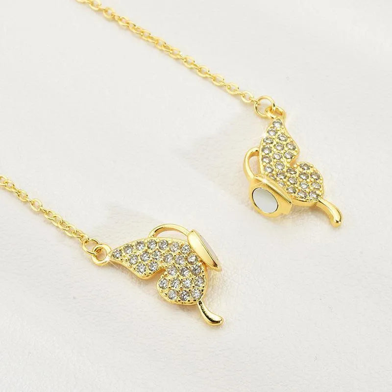 Gold titanium steel twisted chain clavicle necklace with magnetic butterfly snap closure.