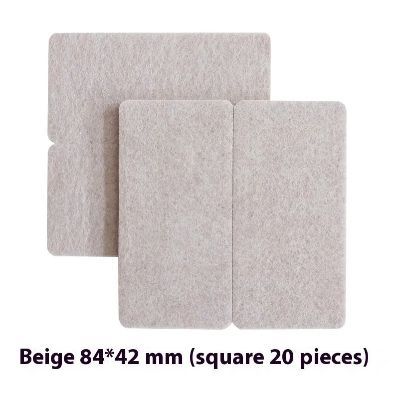 Beige plastic furniture leg stopper pads in five different sizes on a wooden floor