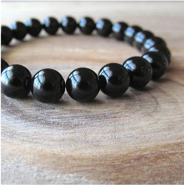 Black onyx geometric bracelet with 8mm beads on a stretchy elastic cord.