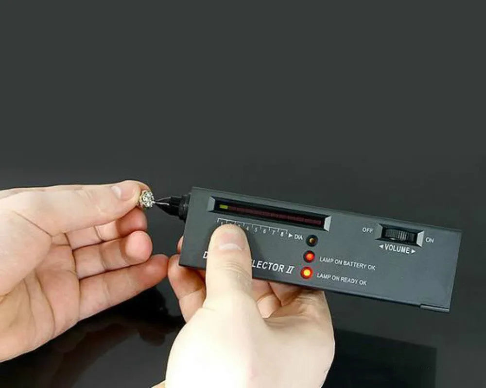 Black portable thermal conductivity meter for diamond testing with metal probe, showing dimensions.