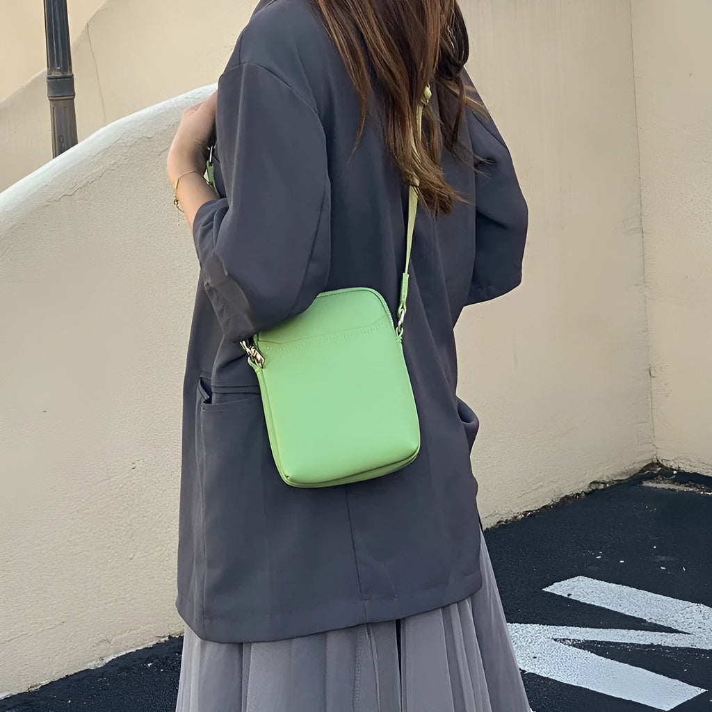 Small solid colour PU leather crossbody shoulder bag for women in beige, black, green, or khaki.