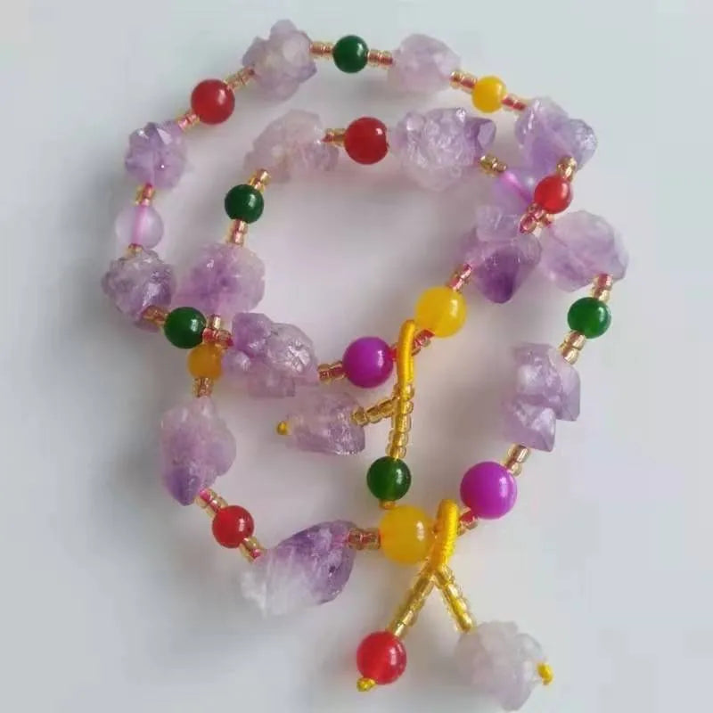 Women's amethyst bead bracelet with natural-shaped stones and fu character charm on adjustable beaded design