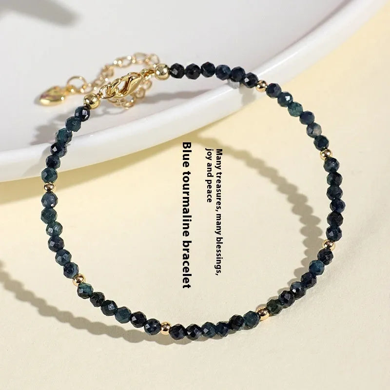 3mm blue tourmaline spacer bead bracelet showing alternating gemstone beads and metal elements
