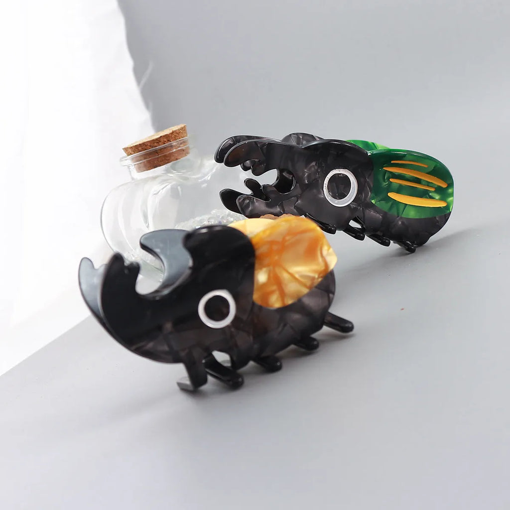 Handmade cellulose acetate beetle grip hair accessory with insect biology design