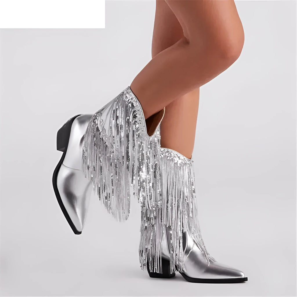 Women's black chunky heel tassel ankle boots with pointed toe on a plain background.
