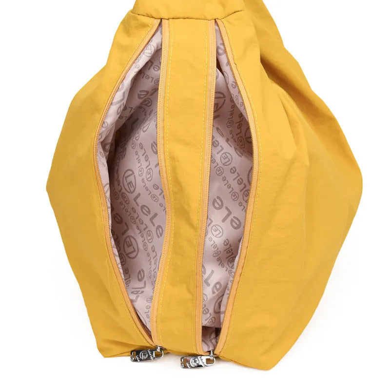 Heart-shaped nylon underarm bag for women in black, blue, khaki, and yellow colour options.