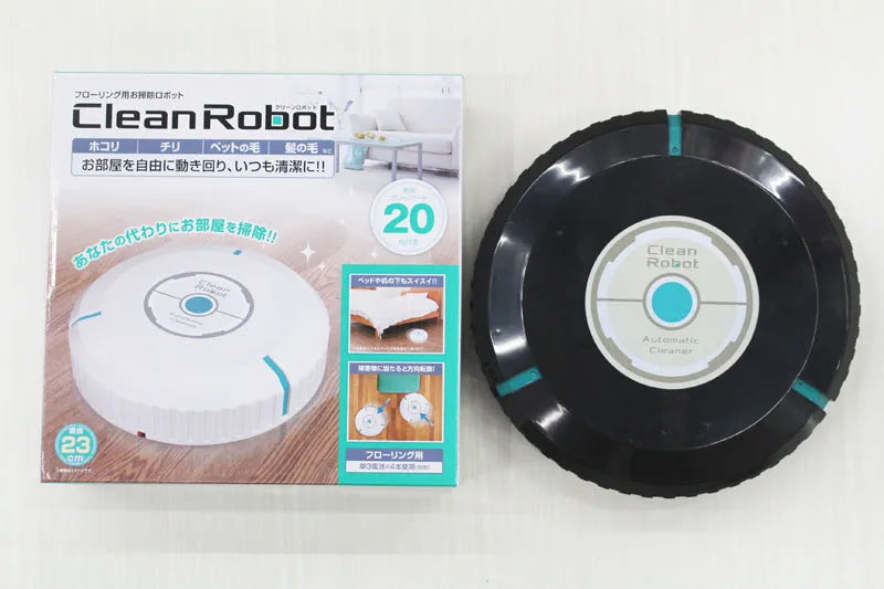 Black and white AC automatic sweeping robot cleaner on a hardwood floor.