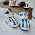 Blue zipper dog shoes with non-slip soles for small dogs, shown alongside pink and red colour options.