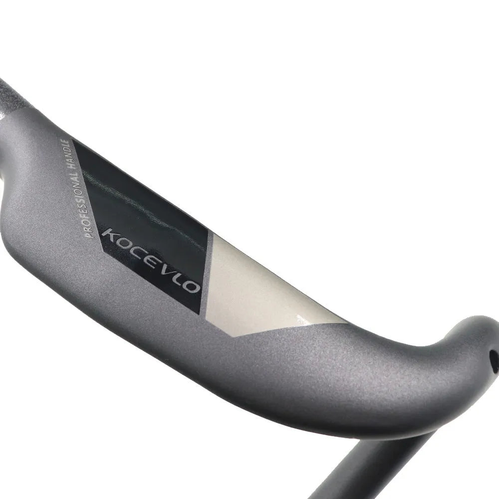 Matte carbon fibre road bicycle handlebar showing bent design with width measurement options