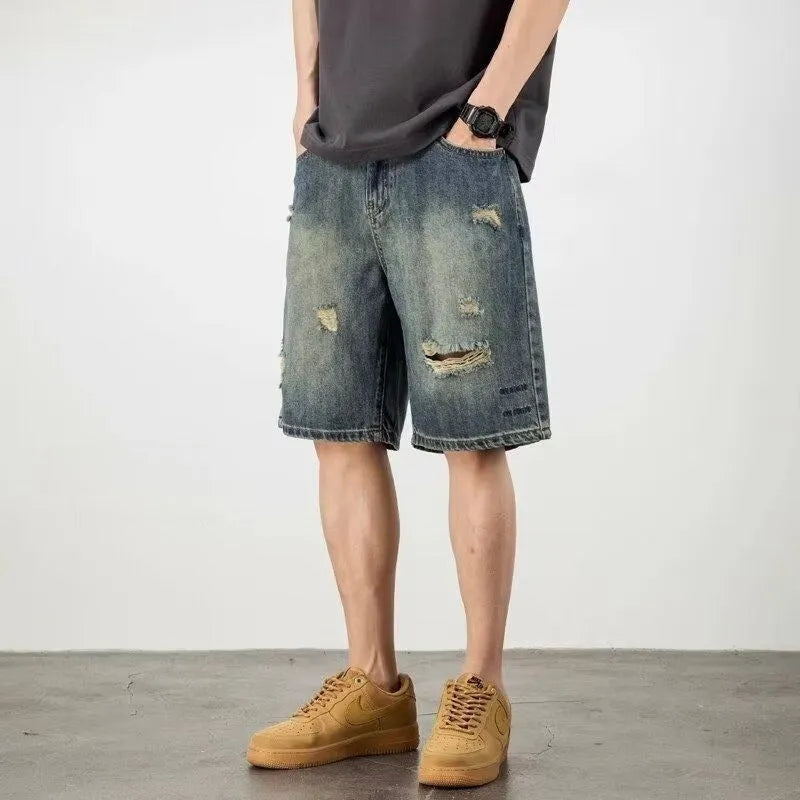 Blue retro distressed denim men's shorts with loose hole detailing and straight cut
