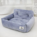 Car-mounted pet travel nest in stain-resistant cloth fabric showing grey and blue plaid options