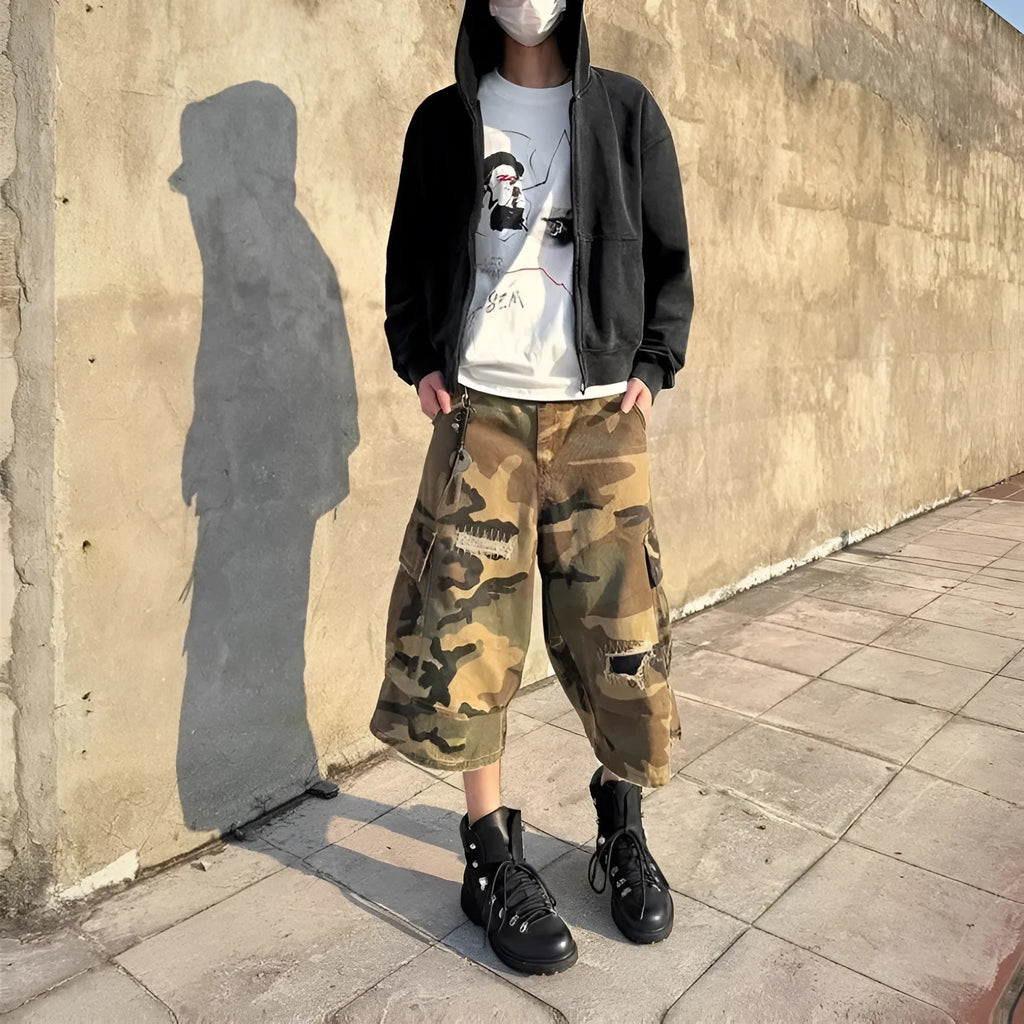 Men's camouflage cropped jeans with patchwork and ripped detailing in straight-leg loose fit
