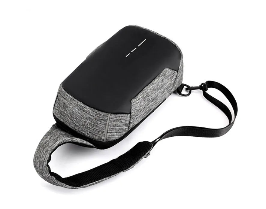 Oxford waterproof chest bag in dark blue colour showing front zipper opening and cross-body strap