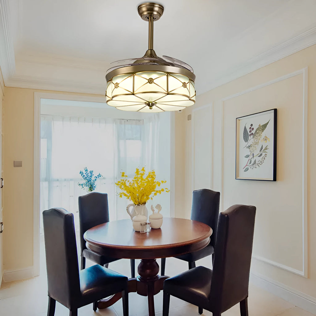 Gold 42-inch ceiling fan light with invisible blades and remote control on a white ceiling