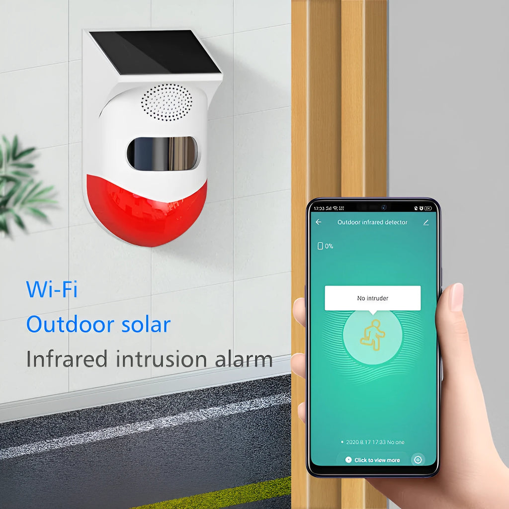Solar panel human body infrared sensing security alarm with remote control on a wall.