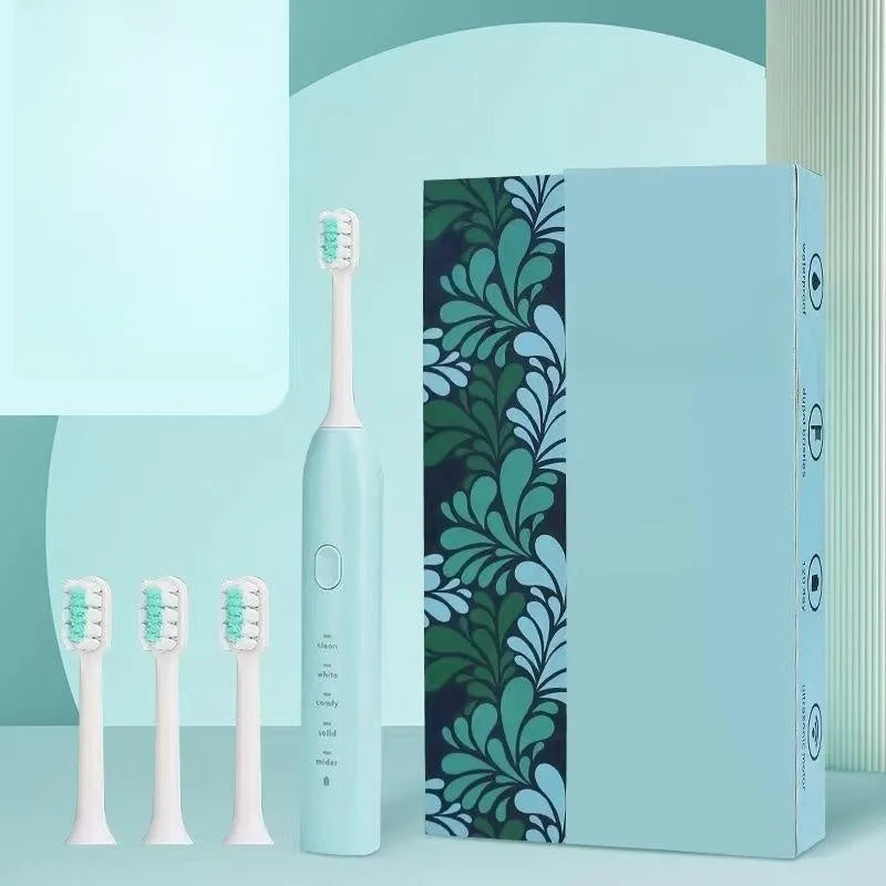 Rechargeable electric toothbrush in yellow with small duck design showing soft bristle brush head