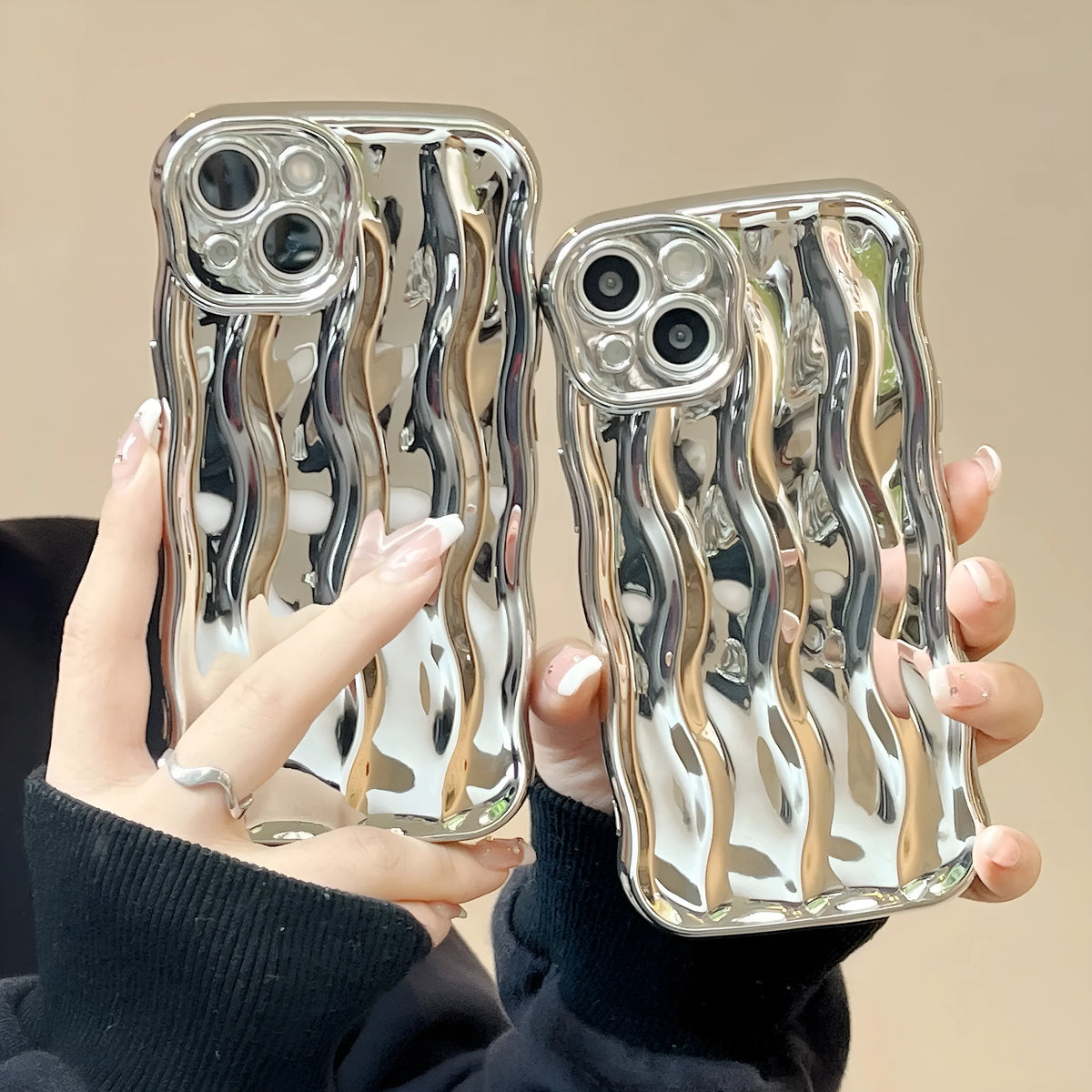 Electroplated wave stripe design on a flexible TPU iPhone 17 protective case in silver finish.