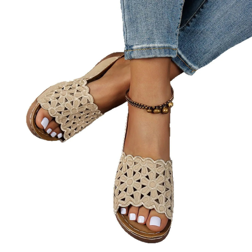 Women's wedge beach slippers with flower cutout design in PVC material showing fish mouth toe shape